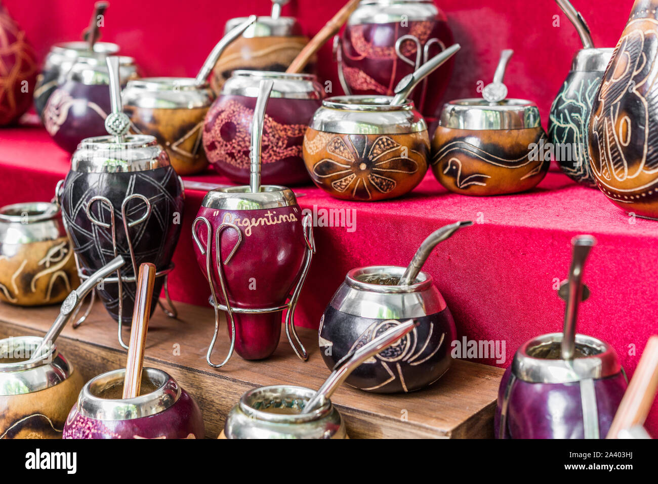 Traditional calabash gourds for Argentina yerba mate tea and bombilla straws. Stock Photo