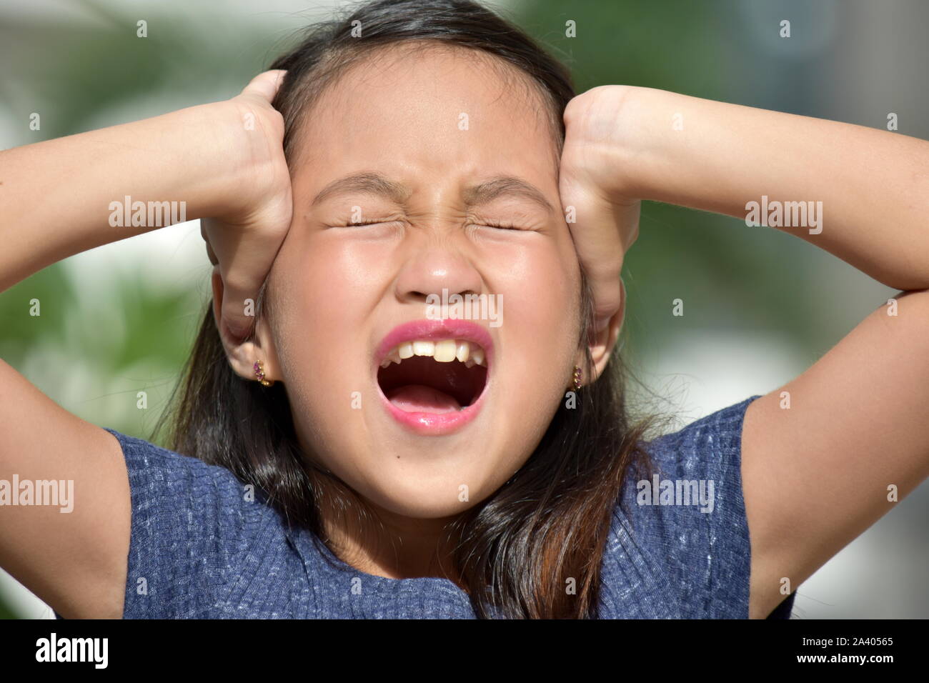 Silent Petite Filipina Person Stock Photo