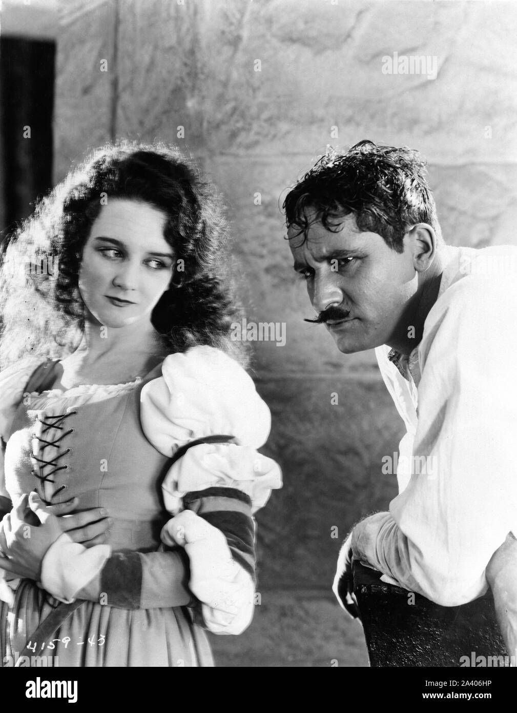 MARY PHILBIN as Christine Daae and NORMAN KERRY as Raoul de