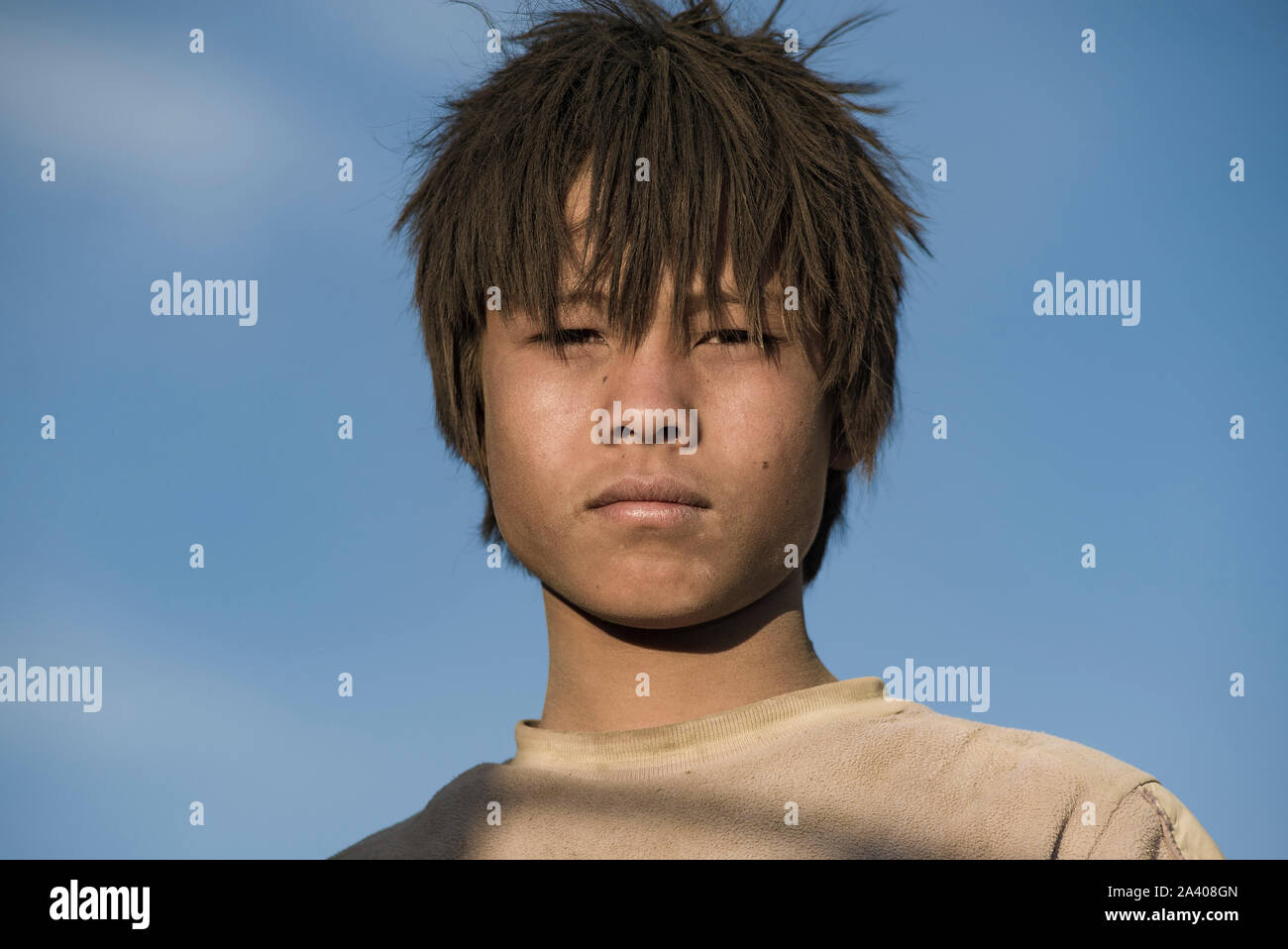 Leh, Jammu and Kashmir, India - July 27, 2011: Portrait of a Leh boy  looking like anime characters on sunny day under bluish sky background  Stock Photo - Alamy
