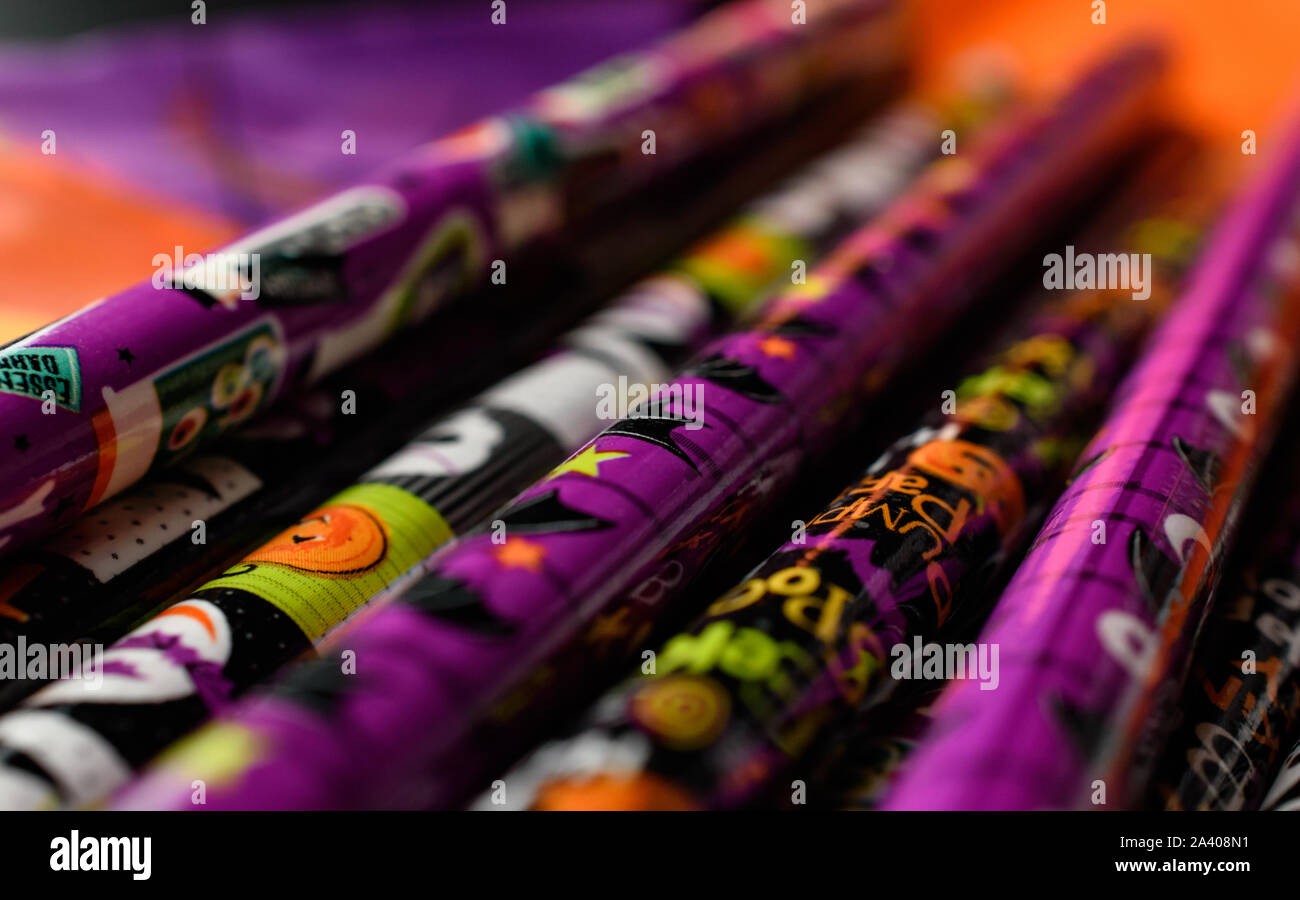 Closeup of Cool Halloween Pencils Isolated on Halloween Theme Colored Background Stock Photo
