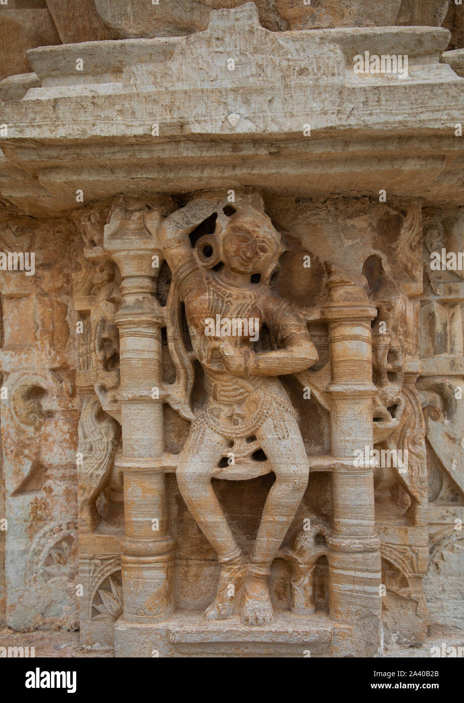 Carved idol on the wall of Vijaya Stambha tower of victory at Chittorgarh fort, Rajasthan, Chittorgarh, India Stock Photo