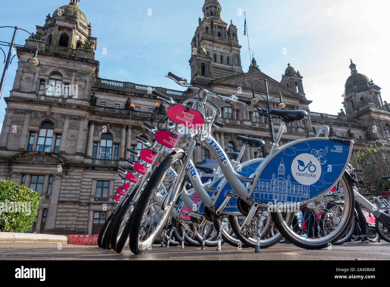 Bikes for hire lined up in front of the City Chambers in George Square Glasgow as part of the promotion of e-bikes. Stock Photo