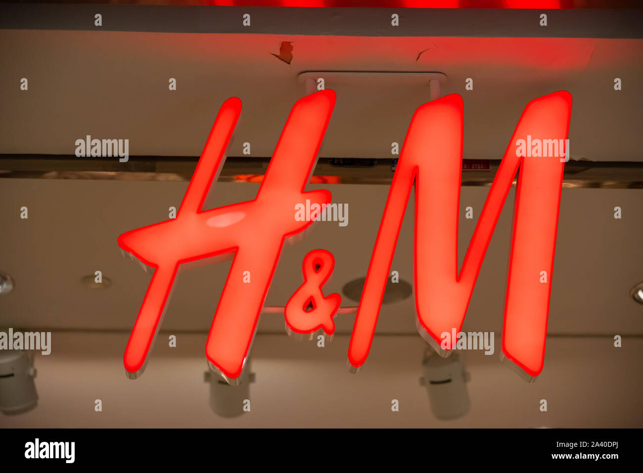 Swedish multinational clothing-retail company Hennes & Mauritz, or H&M,  logo seen in Shenzhen Stock Photo - Alamy
