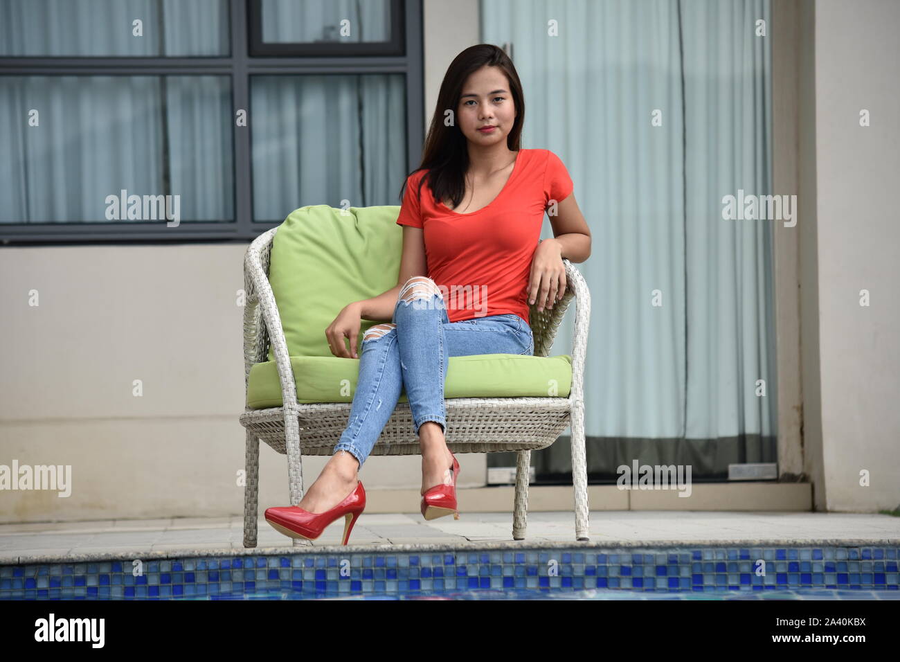 Beautiful Filipina Adult Female And Elegance Sitting Stock Photo - Alamy