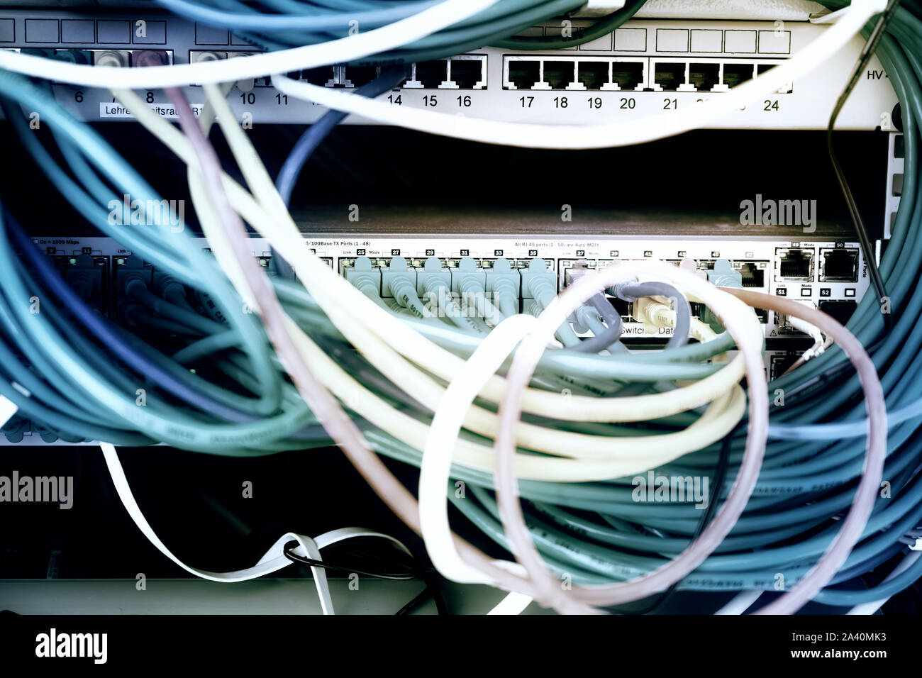 network server rack with colorful cables and ethernet switches in the ...