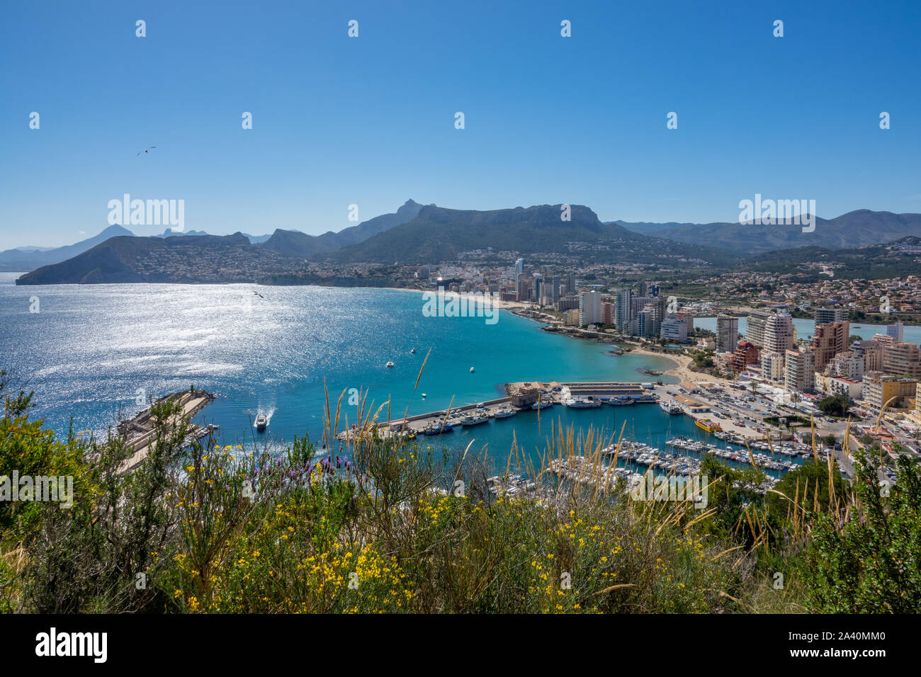 Blue ocean and sunny sky at seaside of Calpe in Spain Stock Photo