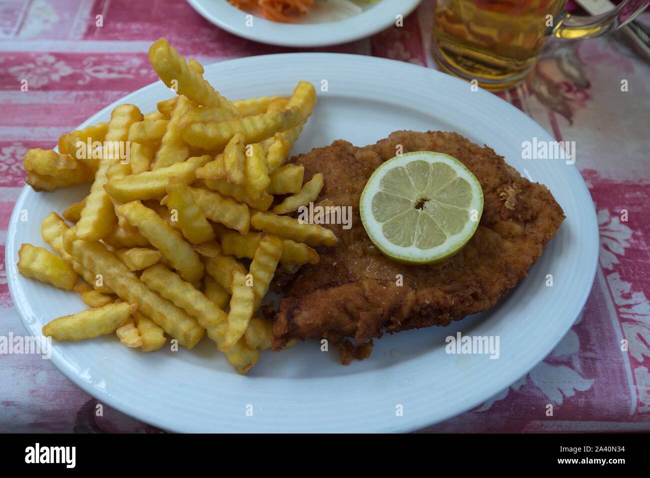 Schnitzel with French fries on a plate, Bavaria, Germany Stock Photo