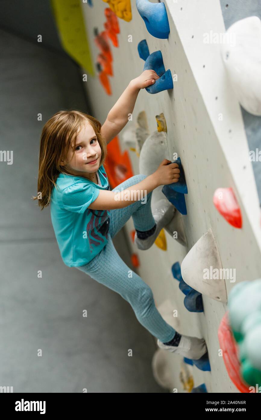 Girl bouldering on a climbing wall in a hall, Germany Stock Photo Alamy