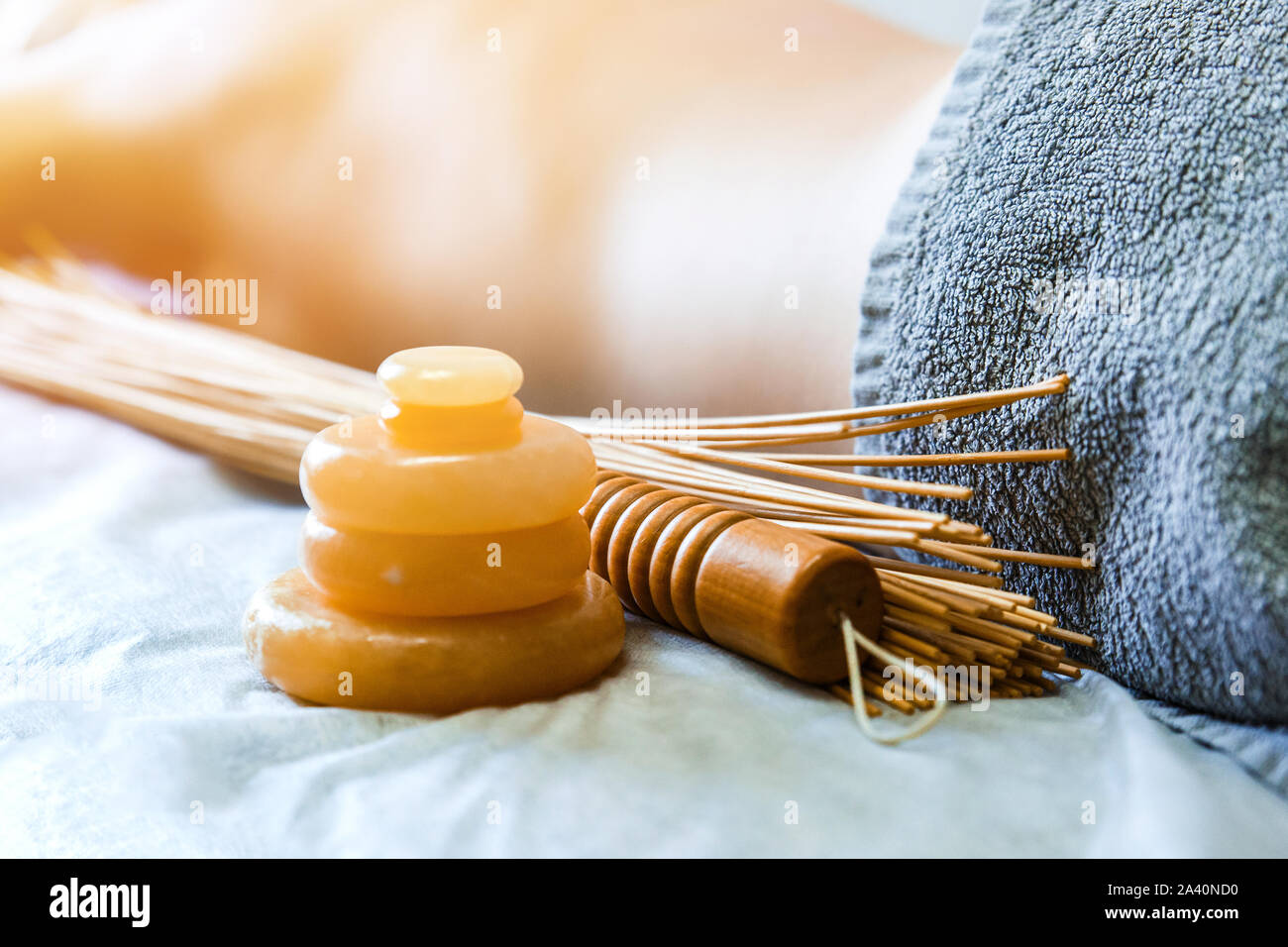 Massage accessories. Stone yellow jade and bamboo beaters for massage