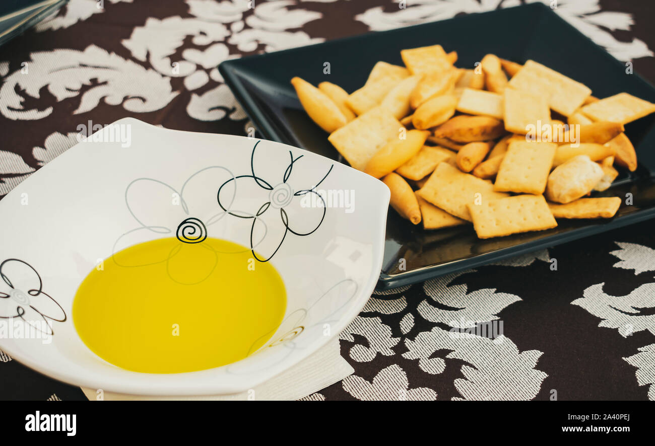 Extra virgin olive oil and bread in an open-air wine tasting Stock Photo