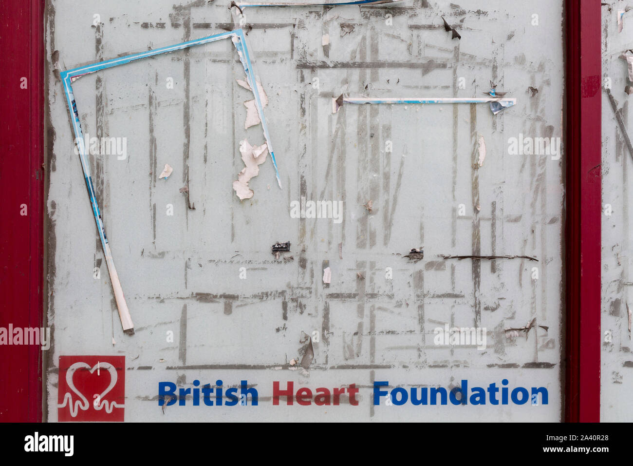 The marks left by posters and flyers are left on a window of a British Heart Foundation retailer in Dartford, on 3rd October 2019, in Dartford, Kent, England. Voters in Dartford voted 64% in favour of Brexit during the 2016 referendum. Stock Photo