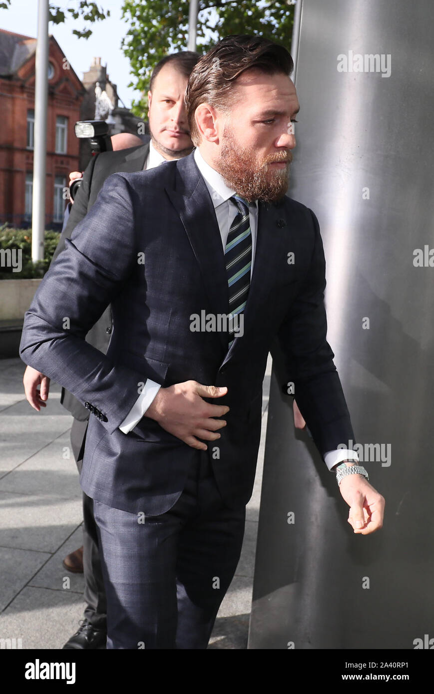 UFC fighter Conor McGregor arrives at the Criminal Courts of Justice, Dublin, where he is appearing on an assault charge after allegedly punching a man at the Marble Arch pub in Drimnagh, Dublin, on April 6, whilst promoting his brand of whisky. Stock Photo