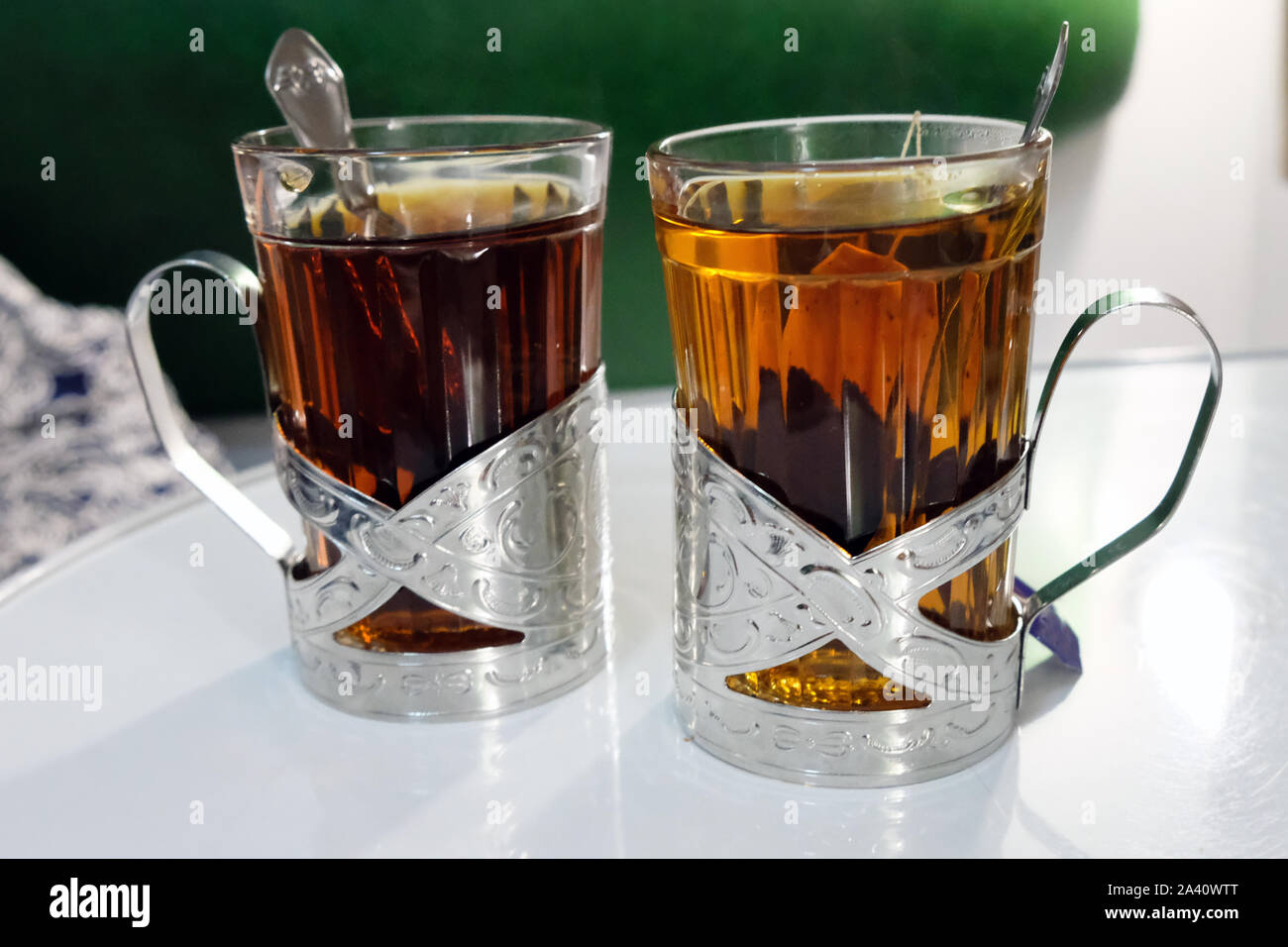 glass and metal tea cups
