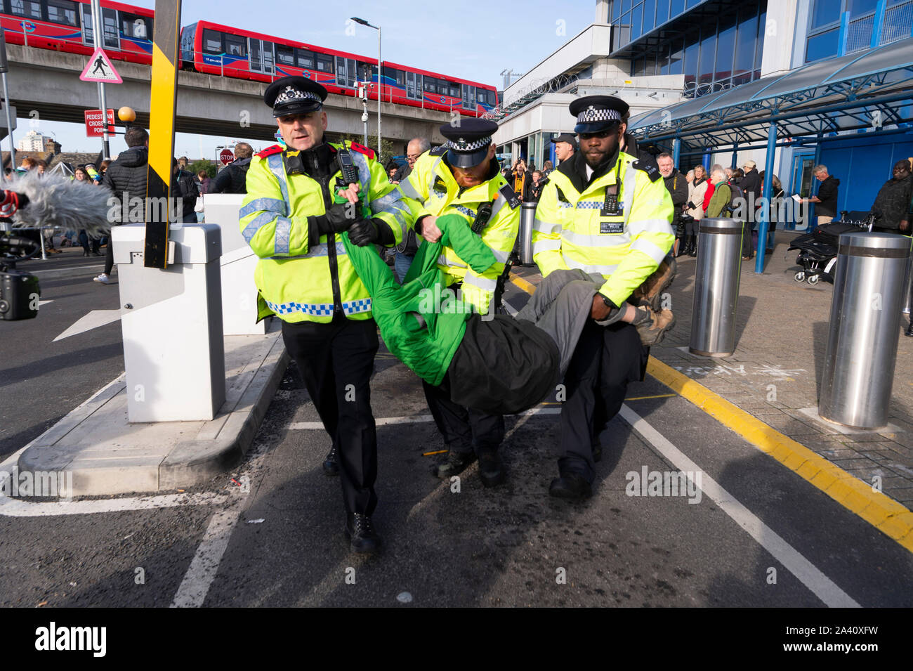 London, Britain. 10th Oct, 2019. An Extinction Rebellion protestor is arrested by police at City Airport in London, Britain, on Oct. 10, 2019. Credit: Ray Tang/Xinhua/Alamy Live News Stock Photo