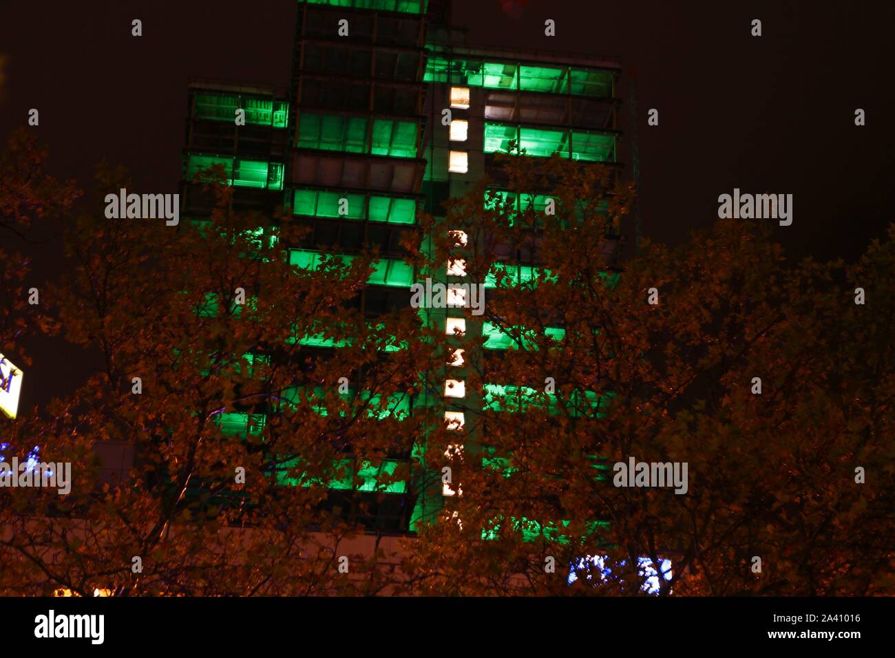 Berlin, Germany. 10th Oct, 2019. The light festival 'Berlin lights' has begun. It is under the motto 'Light changes' this year. Artists from all over the world illuminate different places and buildings in the city with colorful colors - including the Steglitzer Kreisel. At the Berlin Festival, light artists are setting spectacular pictures of buildings in the city with light and projections. The photo shows the Steglitzer spinning top illuminated in color in the evening. (Photo by Simone Kuhlmey/Pacific Press) Credit: Pacific Press Agency/Alamy Live News Stock Photo