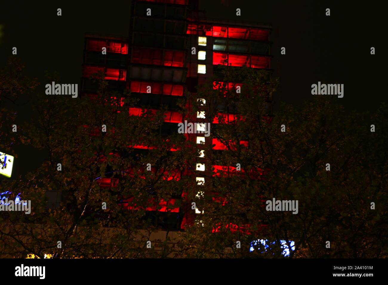Berlin, Germany. 10th Oct, 2019. The light festival 'Berlin lights' has begun. It is under the motto 'Light changes' this year. Artists from all over the world illuminate different places and buildings in the city with colorful colors - including the Steglitzer Kreisel. At the Berlin Festival, light artists are setting spectacular pictures of buildings in the city with light and projections. The photo shows the Steglitzer spinning top illuminated in color in the evening. (Photo by Simone Kuhlmey/Pacific Press) Credit: Pacific Press Agency/Alamy Live News Stock Photo