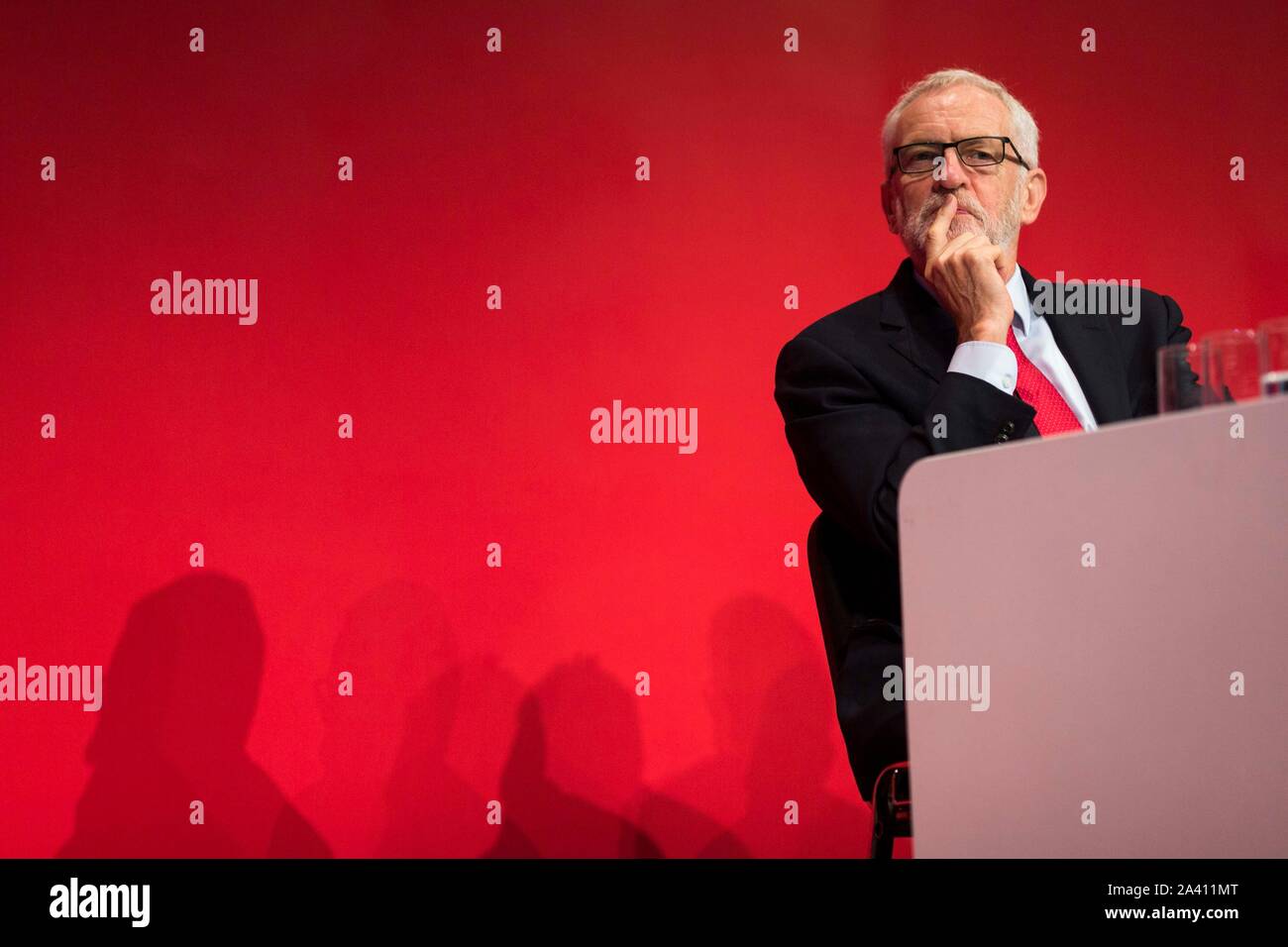 © Chris Bull. 23/09/19  BRIGHTON   , UK.    Labour Party Annual Conference 2019 in Brighton. John McDonnell  MP , Shadow Chancellor of the Exchequer is pictured today (Monday 23rd September) delivering his conference speech.  Jeremy Corbyn on stage during speech    Photo credit: CHRIS BULL Stock Photo