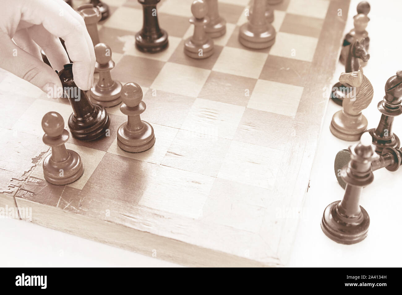 Chess game. Black castle attacked white pawn Stock Photo