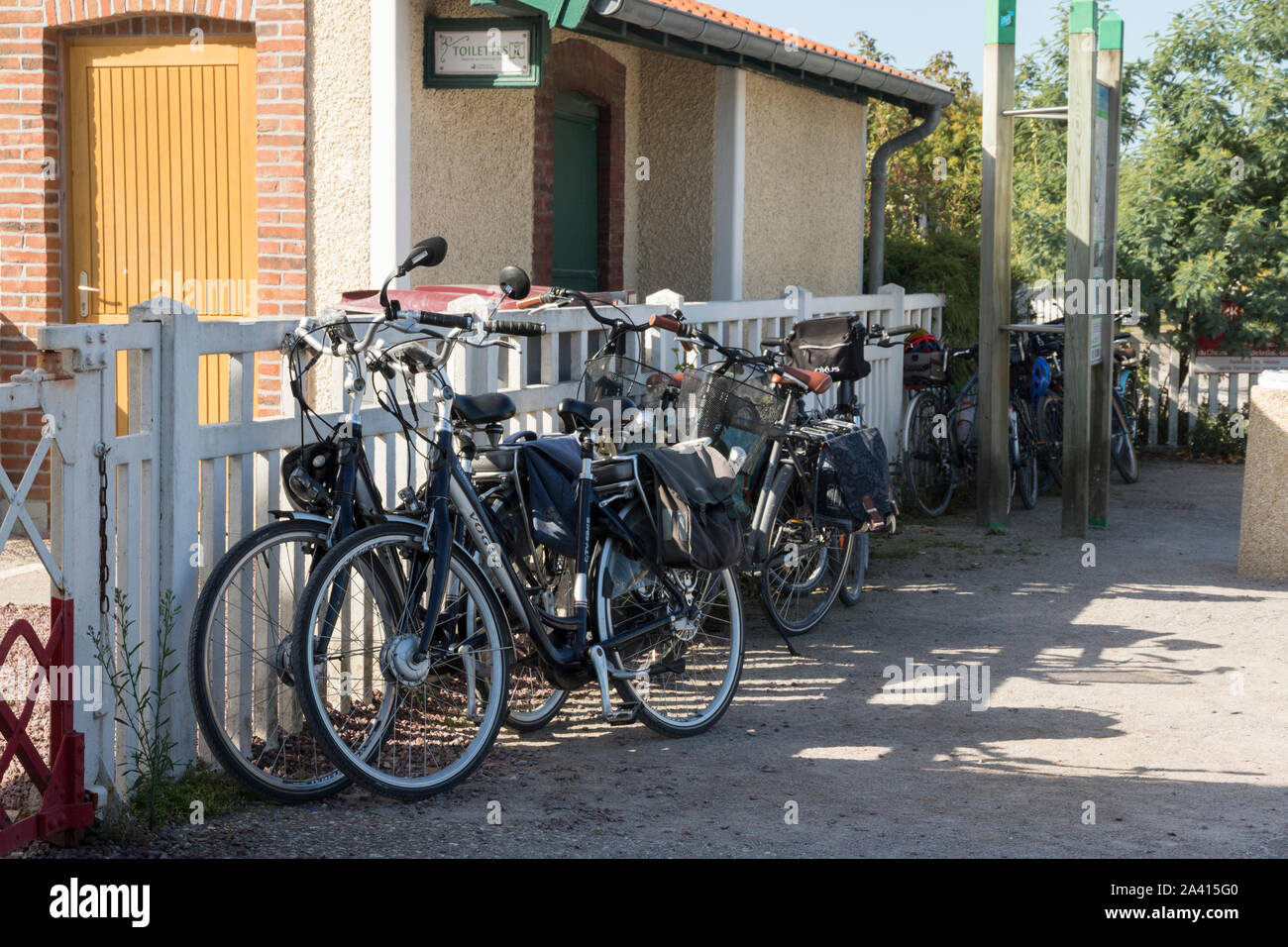 Le Crotoy, Picardy, France, cycles tied up at the station, Chemin de Fer de la Baie de Somme, electric cycles Stock Photo