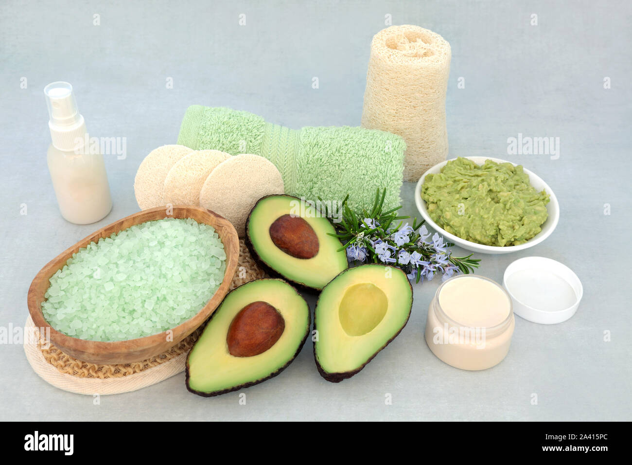 Beauty treatment for skincare with avocado face mask, rosemary herb, exfoliation mineral salts, moisturising cream,  lotion & cleansing products. Stock Photo