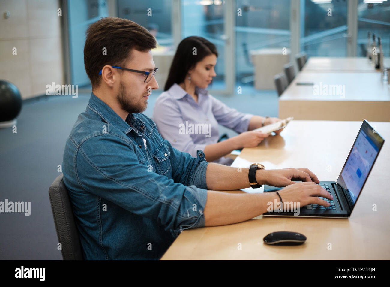 Students studying in a public library. Stock Photo