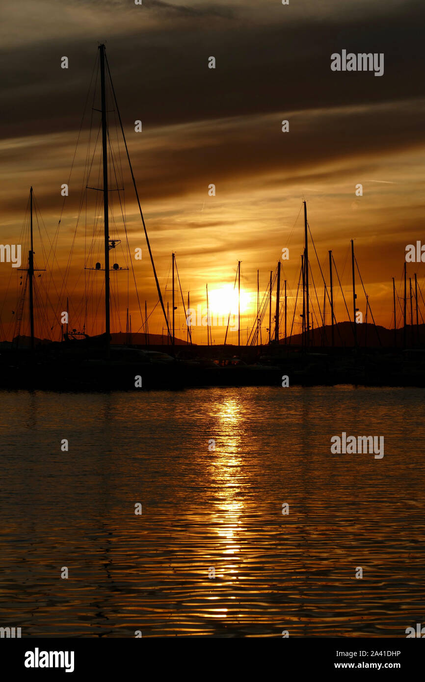 Panoramic view of marina at sunset. Colorful landscape on a summer night in Alghero, Sardinia, Italy. Stock Photo
