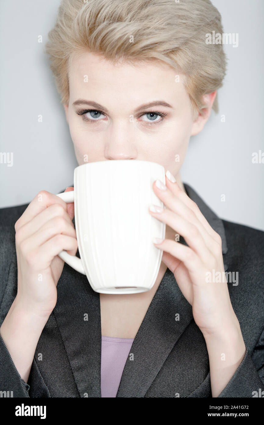 Professional business woman taking a coffee break Stock Photo - Alamy