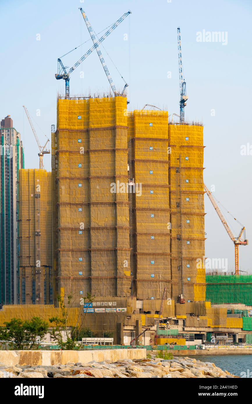 Construction of new  dense urban high-rise apartment buildings in LOHAS Park new housing estate in New Territories of Hong Kong, China. Stock Photo