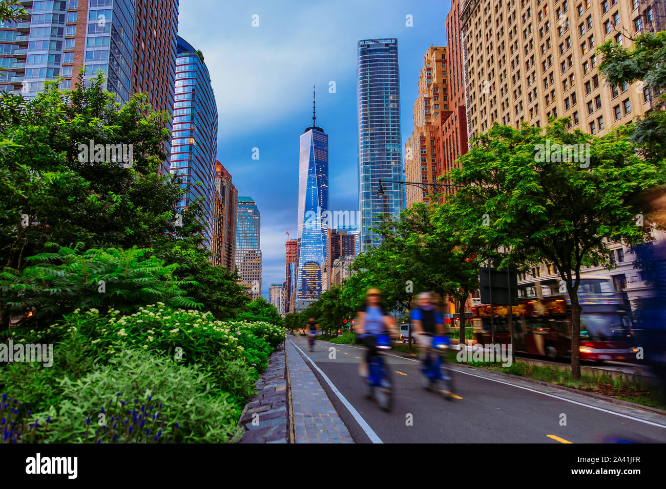 Hudson River Greenway and cyclists with One WTC view in New York City Stock Photo