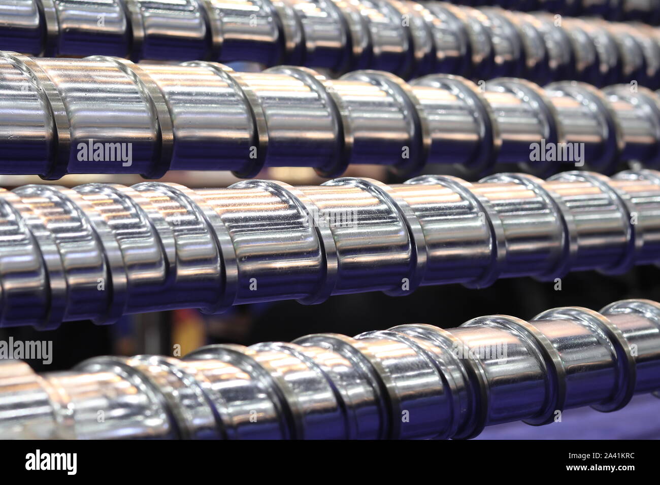 Screw press parts for plastic injection machine ; selective focus Stock Photo