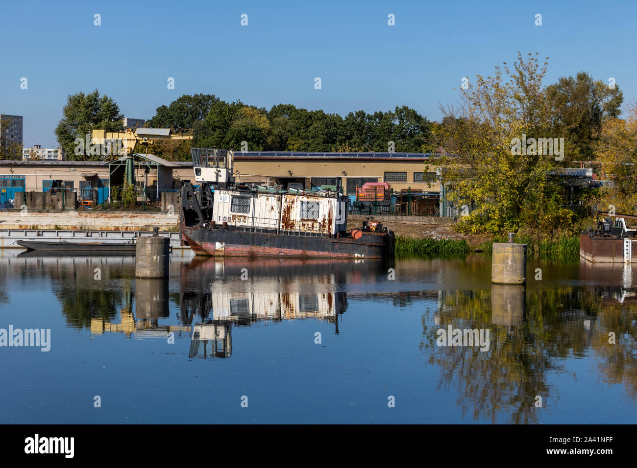View of a rusty boat on the Elbe (Labe) river in Pardubice, Czech Republic. Stock Photo