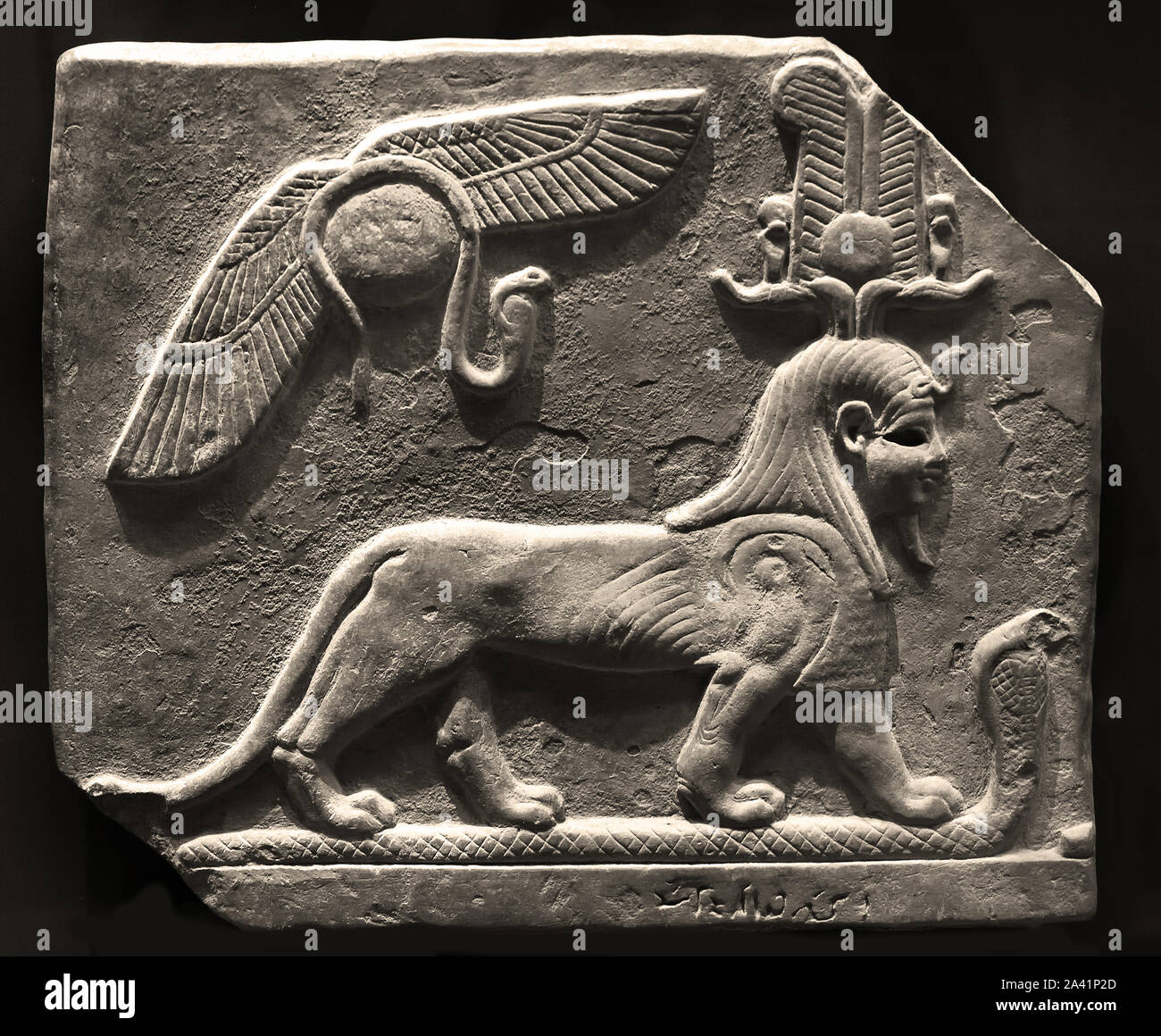 The dog Toutou stomping a cobra 4th - 3rd century BC limestone ( Toutou is a God who fights evil spirits.) Egypt, Egyptian. Stock Photo
