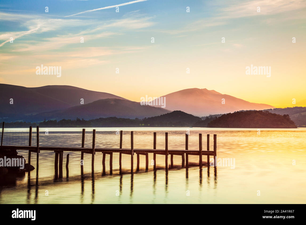 Sunrise over Derwent Water from Brandelhow, Lake District, Cumbria, England, UK Stock Photo