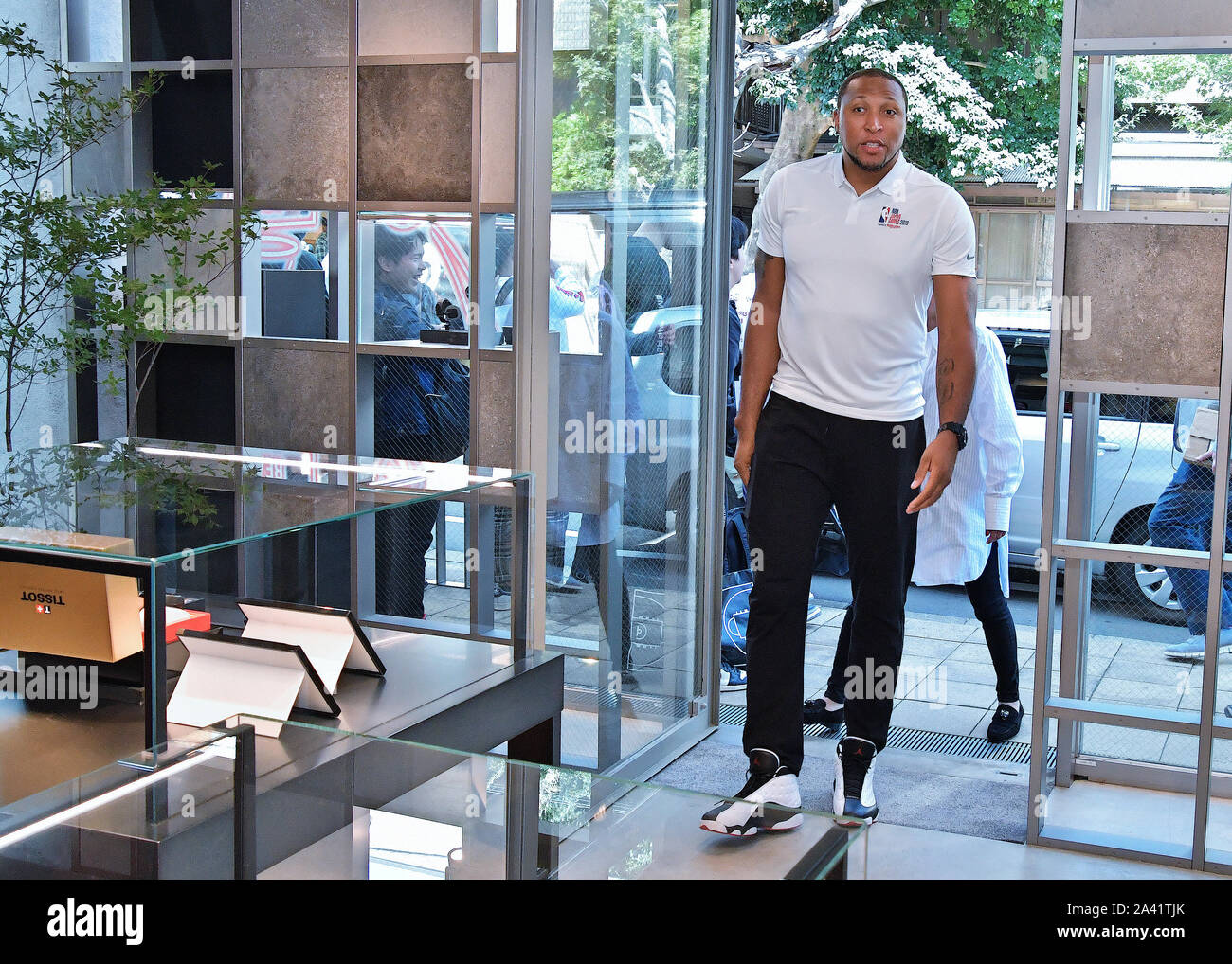 Former professional basketball player Shawn Marion visits at Tissot