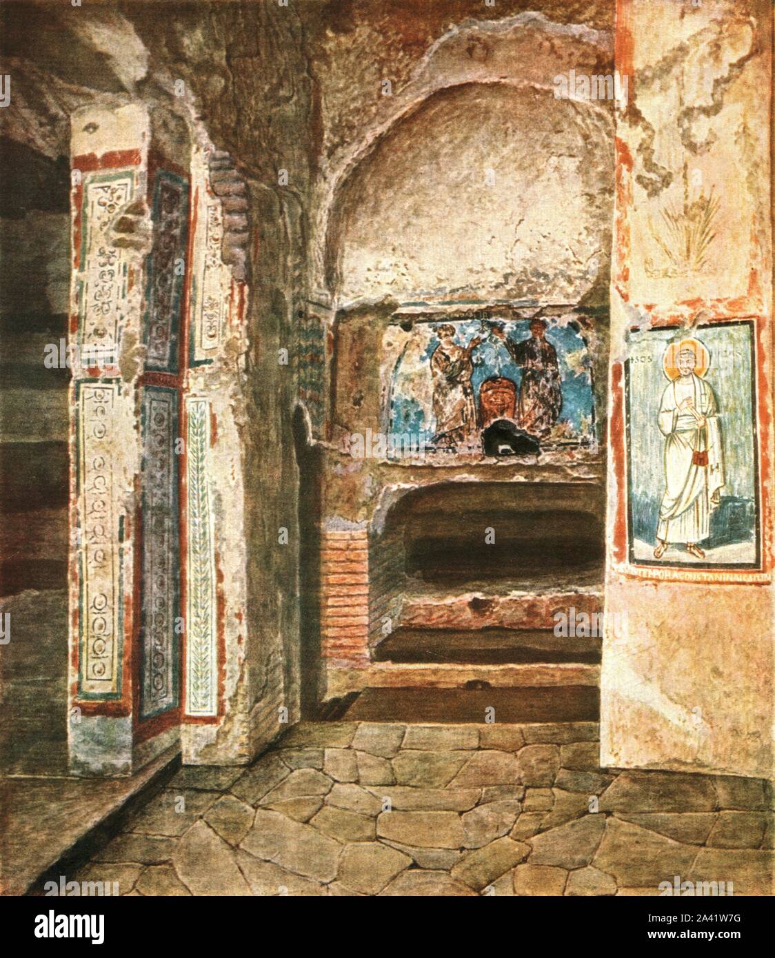 The burial-chapel of SS. Felix and Adauctus in the Catacombs of Commodilla, Rome, Italy, (1928). '4th and 7th Century...In the background the tomb of St. Felix, over it the two martyrs; between them, above, the monogram of Christ, below a shrine with sacred parchments. From the times of Damasus (366-384) and Siricius (384-398)...On right of St. Felix' tomb St. Luke with an inscription: &quot;Sub Tempora Constantino Augusto Nostro Factum Est.&quot; [Wilpert] states that this inscription refers to the Emperor Constantine IV, Pogonatus (668-685)'. After Joseph Wilpert. Plate XLVIII, fig 106, from Stock Photo