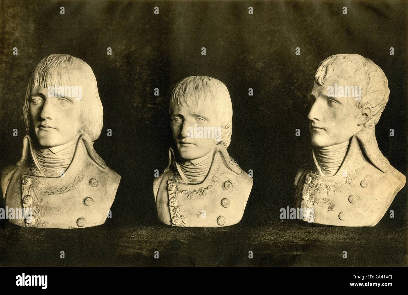 Busts of Napoleon, late 18th century, (1921). Plaster bust portraits of Napoleon Bonaparte (1769-1821). Left and centre: busts made by Louis-Simon Boizot, chief sculptor of the S&#xe8;vres factory, the first in 1798, and the second in 1799 after Napoleon's return from the Egyptian Campaign; right: bust by an unknown artist, possibly Cartellier. All made at S&#xe8;vres in France. From &quot;Napoleon&quot;, by Raymond Guyot. [H. Floury, Paris, 1921] Stock Photo