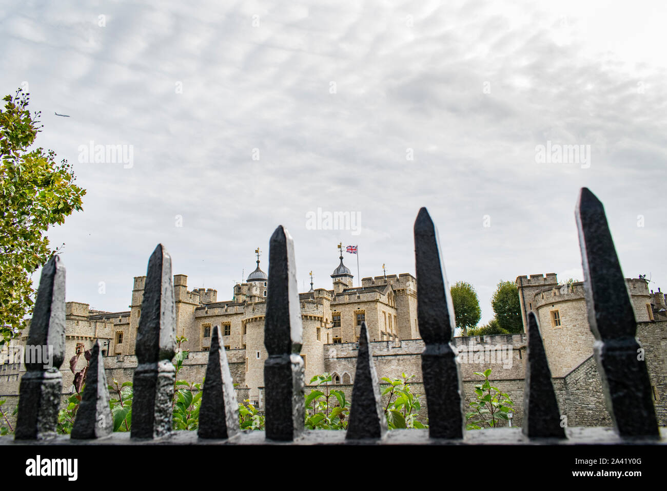 Tower of London through cast iron railings in London Stock Photo Alamy