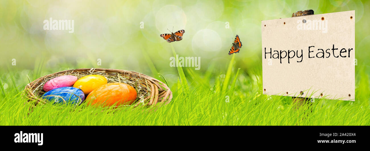Banner sign Happy Easter with Easter basket Stock Photo