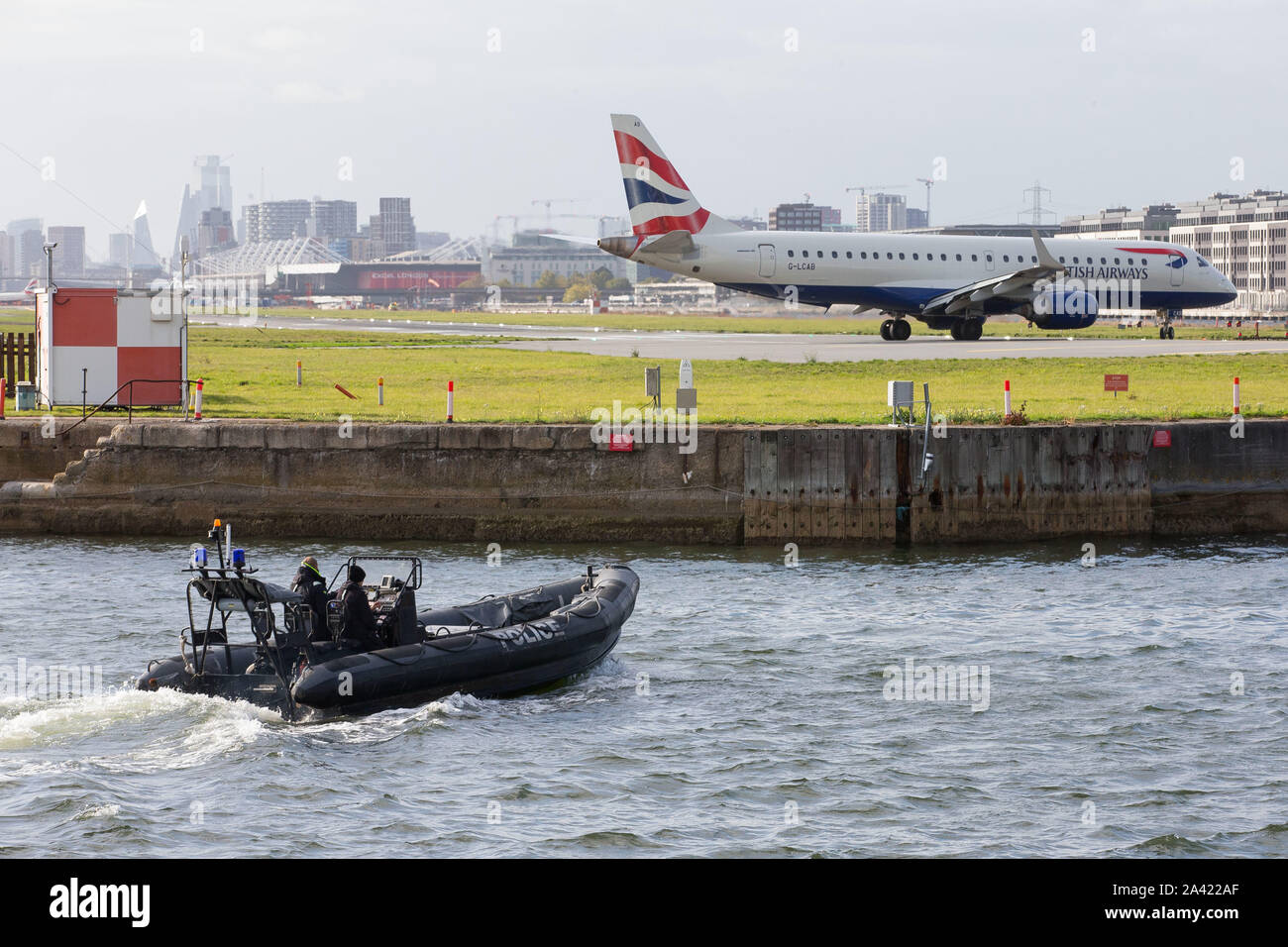 A marine police rigid inflatable boat RIB patrols the water around the ...