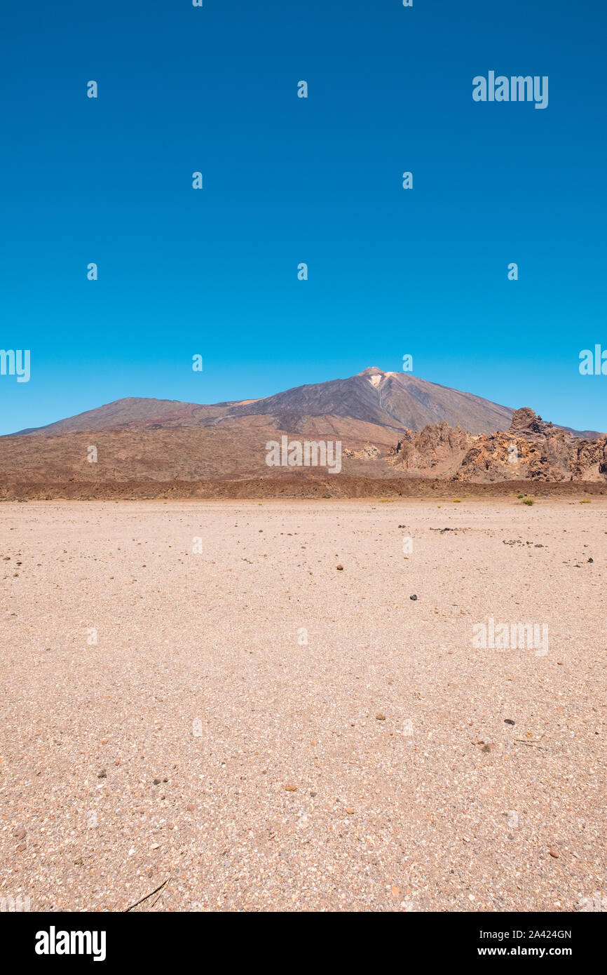 desert landscape with blue sky and mountain background, Teide, Tenerife Stock Photo