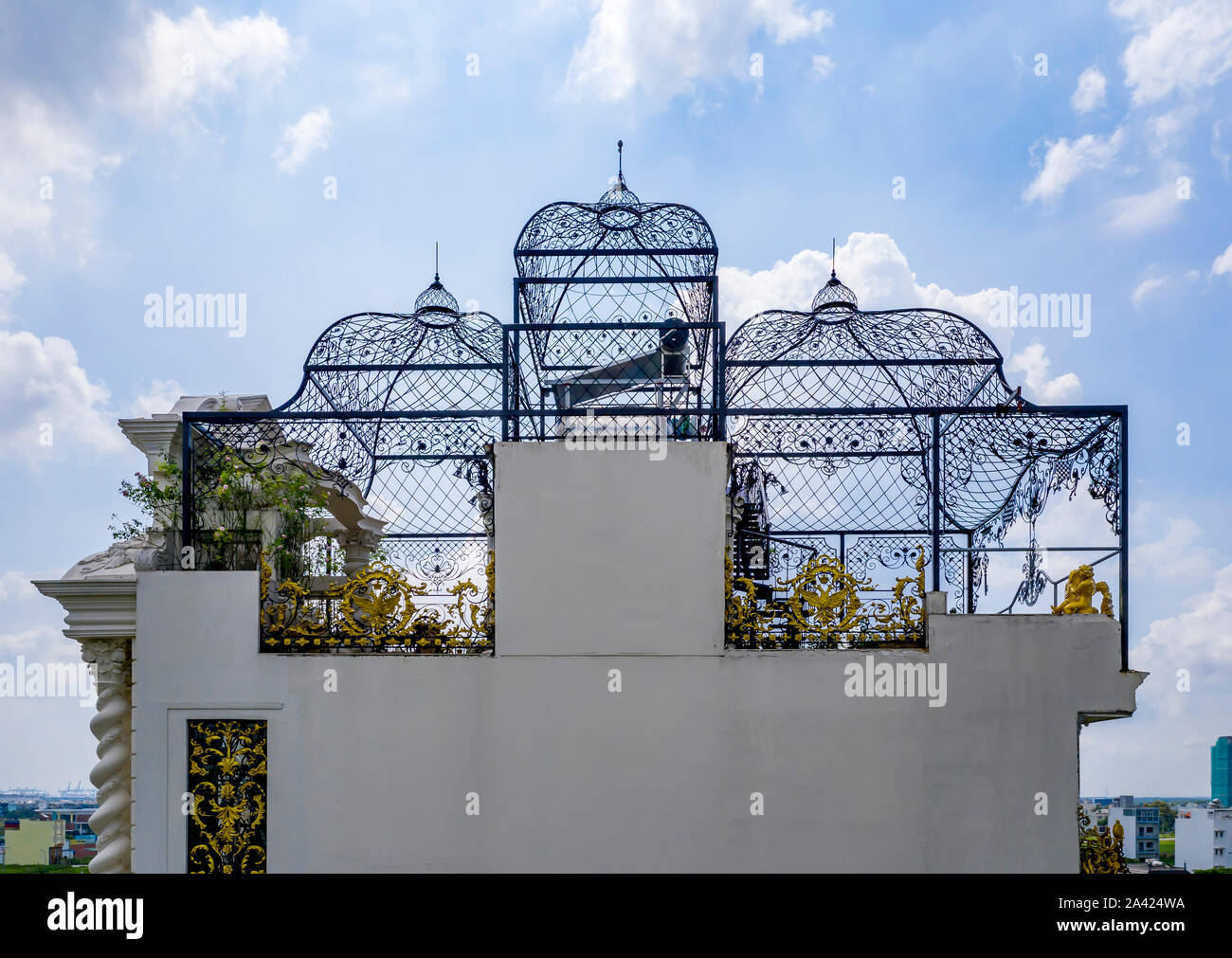 Ornate bird cage inspired roof design on grand mansion rooftop
