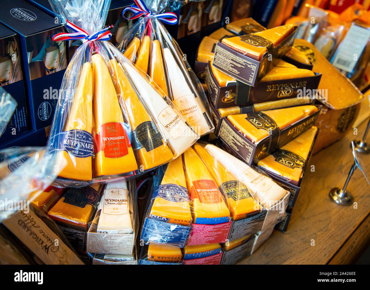 gift wrapped assorted Branded cheeses on display for sale at the cheese