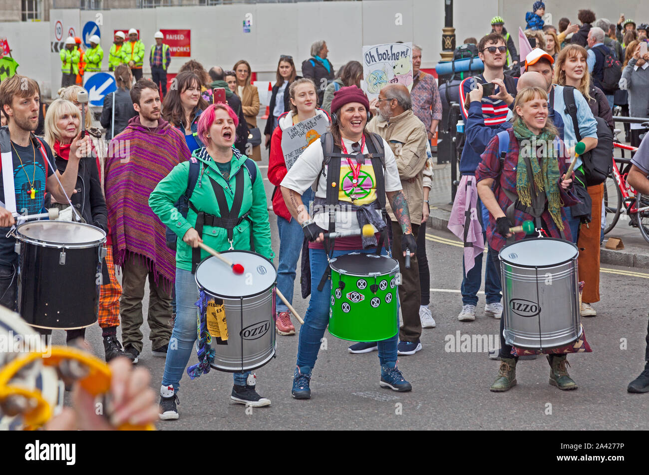 October 8th, 2019. The first day of Extinction Rebellion's occupation of Trafalgar Square.  Drummers beating out the Extinction Rebellion message. Stock Photo