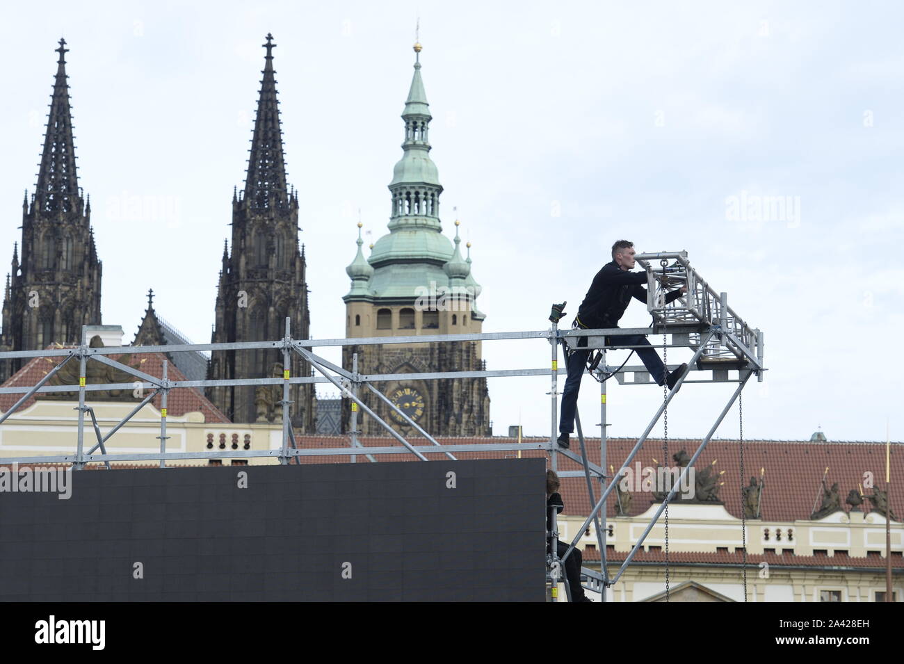 The instalation of the large-scale screen on Hradcany square outside the Prague Castle, Prague, Czech Republic, October 11, 2019. On Saturday, October 12, a mourning ceremony will take place in St Vitus Cathedral at the Prague Castle, the seat of Czech kings and presidents, at 11:00. The heritage site will be partially closed to the public until 14:00 over the event that will be for invited guests only. The public can watch it on large-scale screens. Czech pop singer Karel Gott died at 80 on October 1, 2019, before midnight at home in his family circle. Gott was at the top of music for some 60 Stock Photo