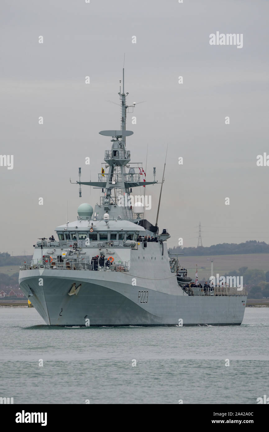 The Royal Navy batch 2 River Class offshore patrol vessel HMS Medway leaving Portsmouth Harbour, UK to take part in a squadron Exercise on 7/10/19. Stock Photo