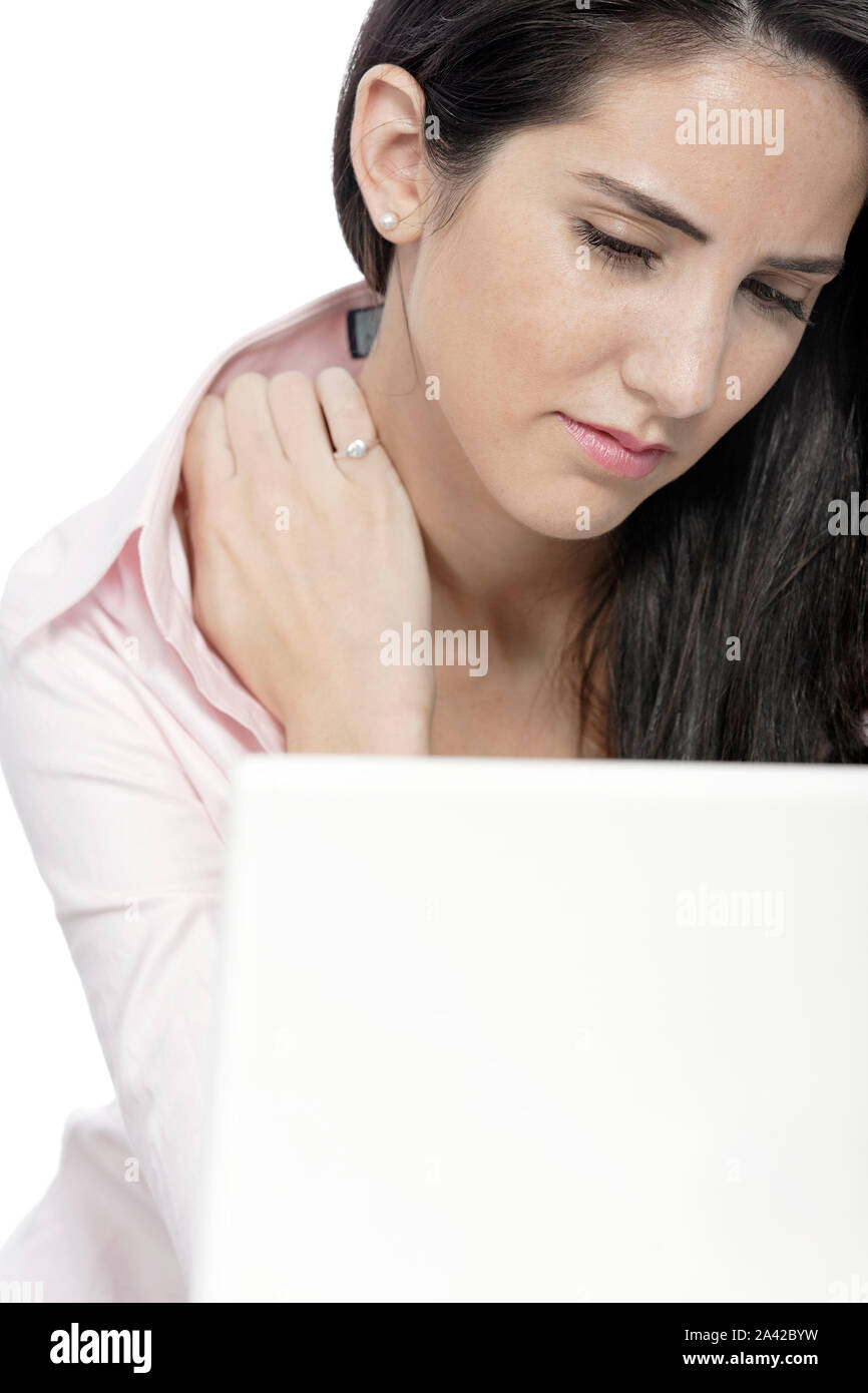 Beautiful young woman with neck pain at her office desk Stock Photo - Alamy