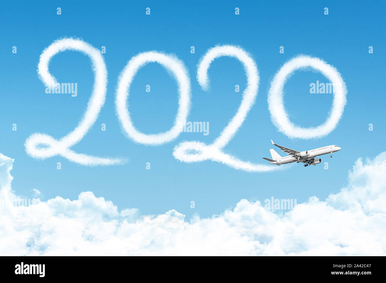 Happy New year 2020 concept travel on the background below cloudscape. Drawing by passenger airplane vapor contrail in sky Stock Photo