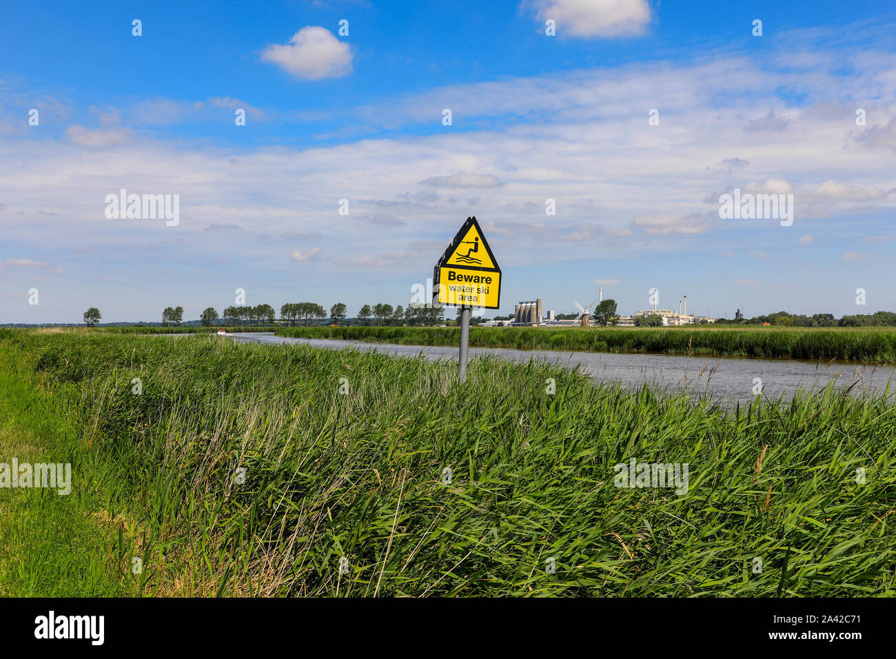A sign saying 'beware, water ski area' on the River Yare, Hardley Marshes, Norfolk Broads, Norfolk, England, UK Stock Photo