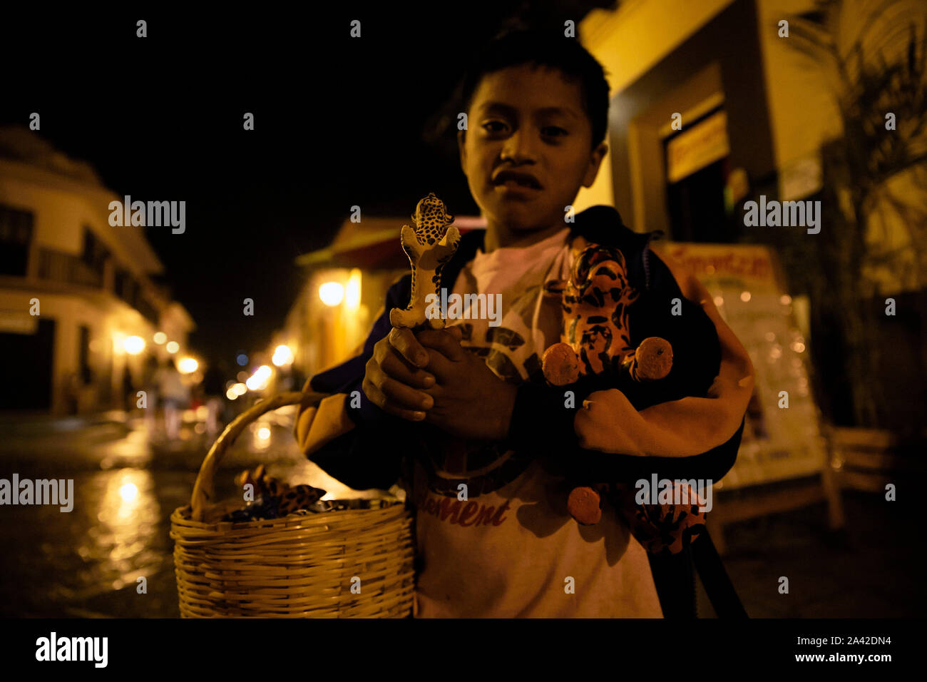 Mexico Chiapas San Cristobal de las Casas child trying to sell in the night 31-05-2013 foto: Jaco Klamer Stock Photo